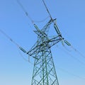 High-voltage power tower under blue sky