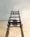 High Voltage Power Transformer on Utility Poles under Dramatic Evening Sky Royalty Free Stock Photo