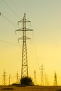 High-voltage power transmission line. Energy pillars. At sunset, dawn. high-tension Royalty Free Stock Photo