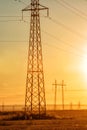 High-voltage power transmission line. Energy pillars. At sunset, dawn. high-tension Royalty Free Stock Photo