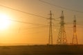 High-voltage power transmission line. Energy pillars. At sunset, dawn. high-tension Royalty Free Stock Photo