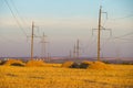 High-voltage power transmission line. Energy pillars. At sunset, dawn. high-tension Royalty Free Stock Photo