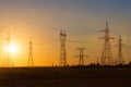 High-voltage power transmission line. Energy pillars. At sunset, dawn. high-tension Royalty Free Stock Photo