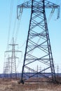 High-voltage power transmission line. Towers with insulators on which the wires are fixed. An extended structure of wires, cables Royalty Free Stock Photo