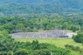 High voltage power transmission towers in forest mountains landscape energy transmission distribution equipment in natural Royalty Free Stock Photo