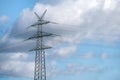 Electricity pylon photographed against a blue sky