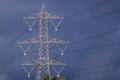 High voltage pylon isolated against a dark and stormy sky Royalty Free Stock Photo