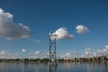 High-voltage pylons of power lines on the river. Royalty Free Stock Photo