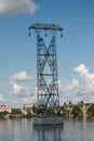 High-voltage pylons of power lines on the river. Royalty Free Stock Photo