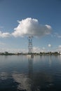 High-voltage pylons of power lines on the river. Royalty Free Stock Photo