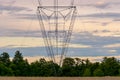High voltage pylons standing in a diminishing perspective Royalty Free Stock Photo