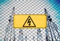 High Voltage Sign and Symbol Caution Signboard on Fence Wire at Electrical Power Plant Station Royalty Free Stock Photo