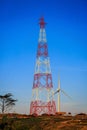 High voltage steel structure towerand wind turbine Royalty Free Stock Photo