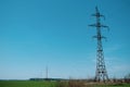 High-voltage tower against the blue sky. Electrical tower with wires Royalty Free Stock Photo