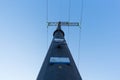 High-voltage tower angle from below against the blue sky Royalty Free Stock Photo