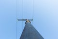 High-voltage tower angle from below against the blue sky Royalty Free Stock Photo
