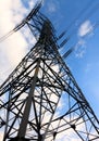 High-voltage tower blue sky background. Royalty Free Stock Photo