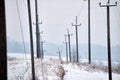 High voltage tower with electric power lines transfening electrical energy through cable wires Royalty Free Stock Photo