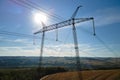 High voltage tower with electric power lines transfening electrical energy through cable wires Royalty Free Stock Photo