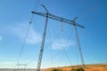 High voltage tower with electric power lines transfening electrical energy through cable wires Royalty Free Stock Photo