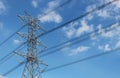 High voltage tower or Electric transmission line with blue sky and white cloud Royalty Free Stock Photo