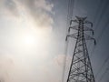 High voltage tower or electricity transmission power lines in the cloudy blue sky Royalty Free Stock Photo