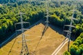 High voltage tower. High voltage. Electricity transmission power lines at sunset (high voltage pylon). Aerial view Royalty Free Stock Photo