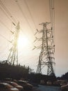 High voltage tower or electricity transmission power lines at the sunset time with a sunray. Royalty Free Stock Photo