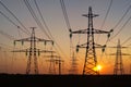 High voltage tower. High voltage. Electricity transmission power lines at sunset (high voltage pylon). Aerial view Royalty Free Stock Photo