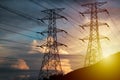 High Voltage Tower on hillside during sunset Royalty Free Stock Photo