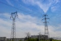 High-voltage tower sky background. Royalty Free Stock Photo