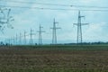 High voltage towers with sky background. Power line support with wires for electricity transmission. High voltage grid Royalty Free Stock Photo