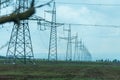 High voltage towers with sky background. Power line support with wires for electricity transmission. High voltage grid Royalty Free Stock Photo