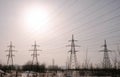 High-voltage towers, transmission line in winter city background. Royalty Free Stock Photo