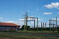 high voltage transformation station view of external capacitors and transformers and maintenance control building Royalty Free Stock Photo