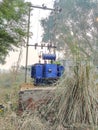 High voltage transformer against the blue sky. Electric current redistribution substation. Transformer station and power lines on Royalty Free Stock Photo