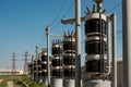 High voltage transformers at electric station on a sunny summer day Royalty Free Stock Photo