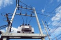 high voltage transformers with power lines and blue sky background Royalty Free Stock Photo