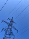 High voltage transmission line electric cables. High voltage tower against a clear blue sky background. Powerline Royalty Free Stock Photo