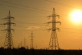 High voltage transmission lines at sunset. Energy and electrification