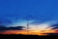 High voltage transmission power lines at sunset