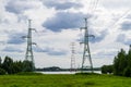 High voltage transmission power tower, electricity pylon on the river Royalty Free Stock Photo