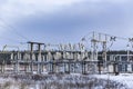 High voltage vintage electrical substation in Ukraine in winter. Wiring, connections and insulators. Russian missile attacks on Royalty Free Stock Photo