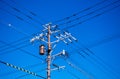 High voltage wires on electric pole with transformer against sky Royalty Free Stock Photo