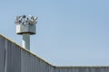 High walls with searchlights as a symbol of borders and prisons