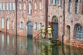 High water flooding the old town of Lubeck when the river Trave overflows its banks, specialists control water level and danger at