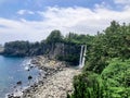 The high waterfall Jeongbang in Jeju island. South Korea Royalty Free Stock Photo