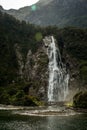 High waterfall in Milford sound fjordland national park New Zealand Royalty Free Stock Photo