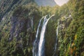 High waterfall in Milford Sound, New Zealand