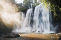 High waterfall in mountains at morning light